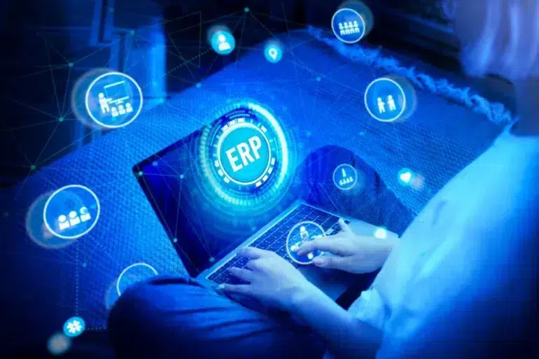 ERP Systems interface displayed on a laptop with connected business icons, illustrating digital management and workflow automation