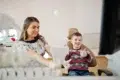 A young boy gives a thumbs up while sitting in a dental chair, showing how family dentistry blends aesthetic results with a positive patient experience for all ages.