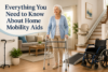 Elderly woman using a walker in a living room equipped with various home mobility aids, including a wheelchair, cane, and stairlift.
