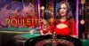A smiling woman in a red dress stands beside a roulette table, exuding a lively casino atmosphere. The text "Live Roulette" is displayed prominently.
