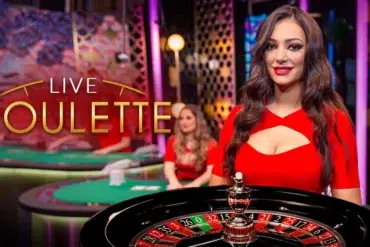 A smiling woman in a red dress stands beside a roulette table, exuding a lively casino atmosphere. The text "Live Roulette" is displayed prominently.