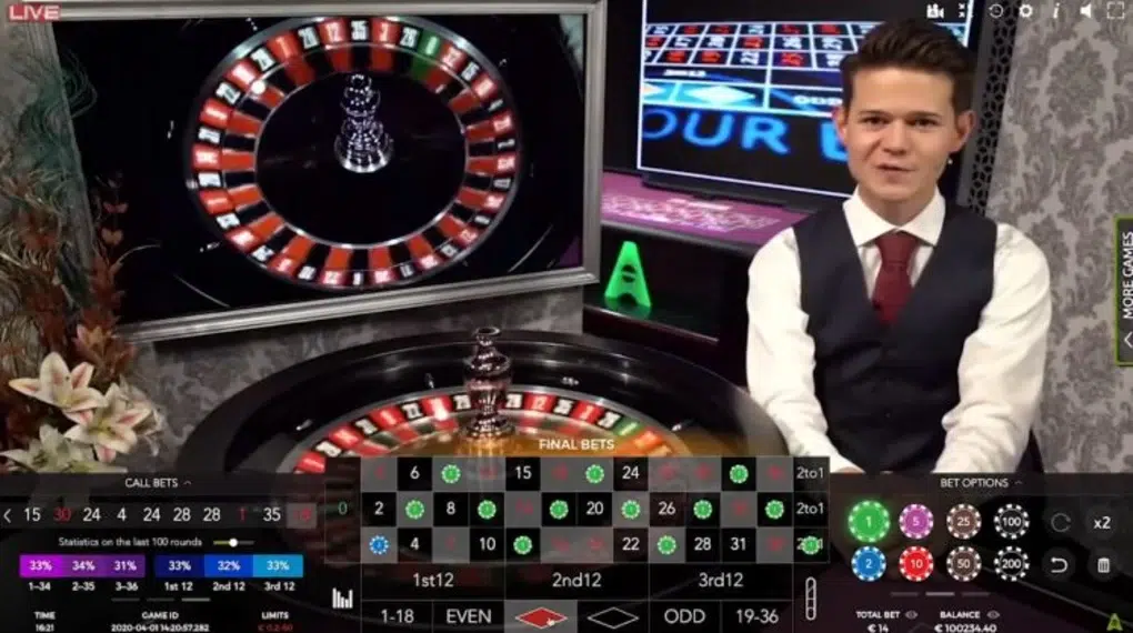 Live casino scene showing a roulette table, with a wheel in motion. A smartly dressed dealer stands nearby, exuding a professional and welcoming demeanor.