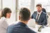 Skilled Divorce Lawyer consulting a couple in a professional office setting, discussing legal matters and relationship concerns