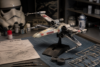 Star Wars Model Kits displayed on a collector shelf with detailed spacecraft, droids, and character models