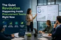 A woman presents procurement data on a screen to colleagues in a modern office.