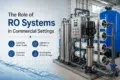 Industrial RO system in a commercial setting with text highlighting benefits: consistent water quality, operational efficiency, equipment protection, and sustainability.