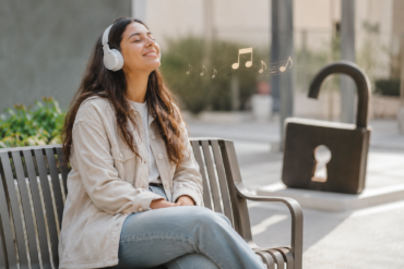 Person safely listening to Unblocked Music online with headphones on a secure digital music platform