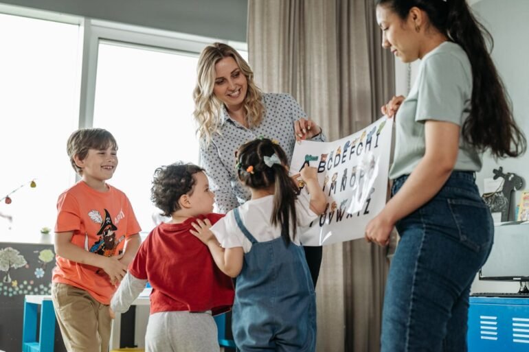 A preschool classroom with children and a teacher engaged in learning activities.