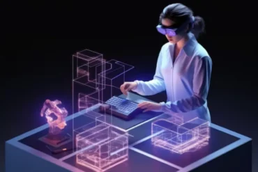 Woman wearing VR headset uses keyboard to interact with holographic architectural designs and a robot arm model.