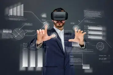 Man wearing VR headset interacts with futuristic data interfaces displaying charts and statistics.