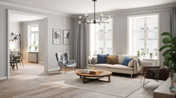 A bright, modern living room with a cream sofa, blue and beige pillows, and a wooden coffee table. Large windows, grey curtains, and green plants add a fresh touch.