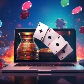 Laptop displaying casino game with poker chips and playing cards appearing to fly out from the screen.