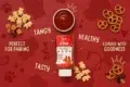 Bottle of healthy ketchup with a bowl of sauce, teddy bear snacks, and pretzels on a red background. Words: "Tangy," "Tasty," "Healthy," "Perfect for Pairing."