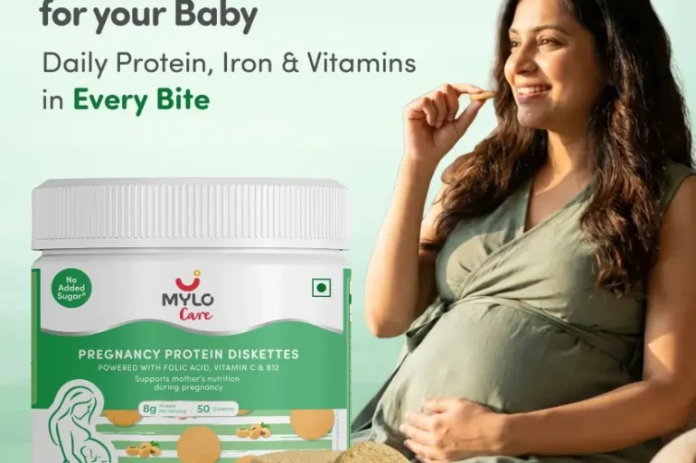 Pregnant woman in a green dress enjoys a Mylo Care pregnancy protein diskette. Product promises nutrients for baby’s strong start. Package shown.