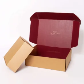 Opened brown cardboard box with a deep red interior and the word "TUSTING" printed inside the lid.