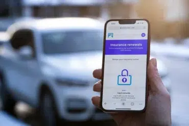 A hand holds a smartphone displaying an "Insurance renewals" webpage with a lock icon. A car is blurred in the background, suggesting online convenience.