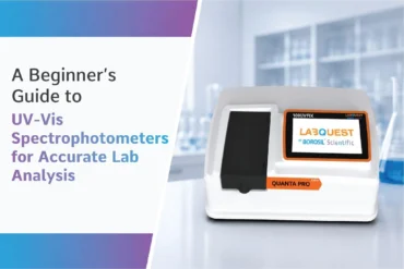 Image of a UV-Vis spectrophotometer in a lab with text reading 'A Beginner's Guide to UV-Vis Spectrophotometers for Accurate Lab Analysis.' Modern, scientific ambiance.