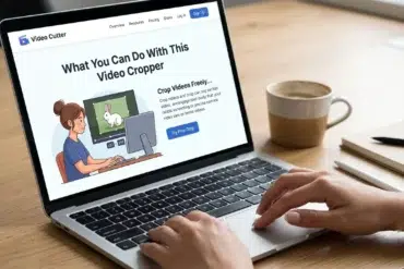 A person types on a laptop displaying a video cropping website. A cup and notebook are nearby. The scene is calm and focused, suggesting productivity.