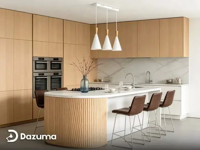 Modern kitchen with light wood cabinetry, double ovens, a marble backsplash, and a curved island with bar stools.