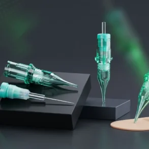 Three green and clear tattoo needle cartridges are displayed on black pedestals against a dark background.