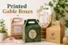 Four decorative printed gable boxes in floral, green, and kraft designs are arranged on a tabletop with plants, ribbon, and twine, beneath the text “Printed Gable Boxes.”