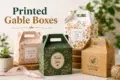 Four decorative printed gable boxes in floral, green, and kraft designs are arranged on a tabletop with plants, ribbon, and twine, beneath the text “Printed Gable Boxes.”