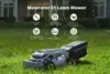 A Mowrator S1 robotic lawn mower with a grass catcher sits on a green lawn in front of a house.
