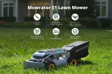 A Mowrator S1 robotic lawn mower with a grass catcher sits on a green lawn in front of a house.