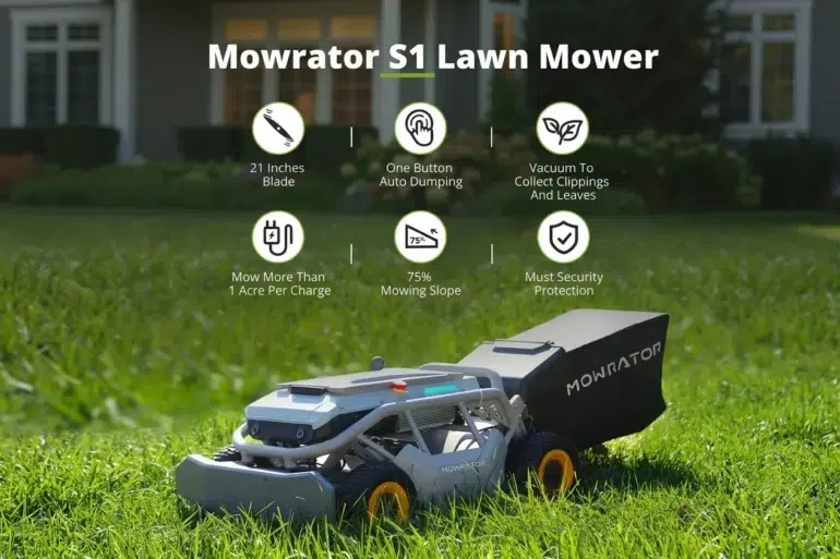 A Mowrator S1 robotic lawn mower with a grass catcher sits on a green lawn in front of a house.
