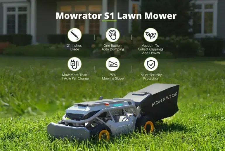 A Mowrator S1 robotic lawn mower with a grass catcher sits on a green lawn in front of a house.