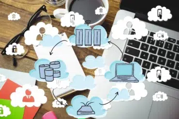 Cloud computing diagram overlays a desk with a laptop, glasses, and coffee, illustrating data storage and connectivity.