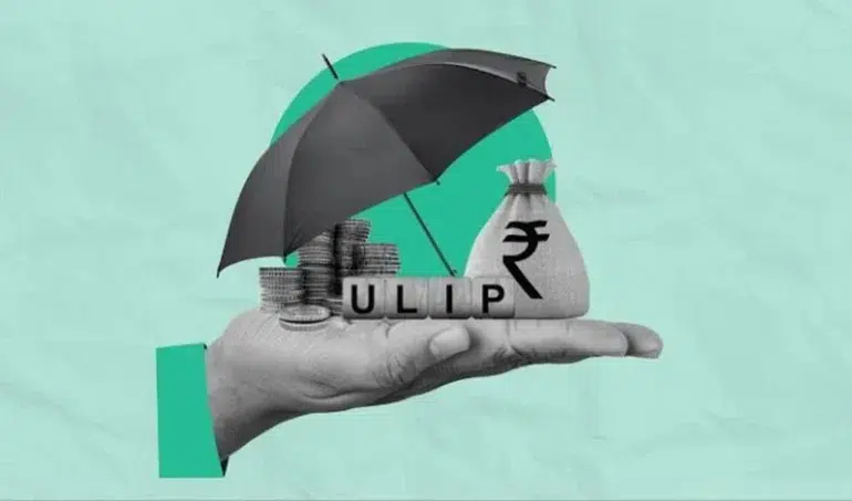 A hand holds an umbrella over coins, a bag with an Indian Rupee symbol, and the letters ULIP.