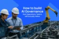 Two manufacturing workers in hard hats review a tablet beside an automated factory line and robotic arm; text reads “How to build AI Governance that Operations Teams will actually follow.”