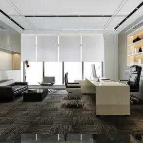 Modern executive office with a black leather seating area, white desk, computer, illuminated display shelves, large windows, and a potted tree.