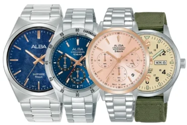 Four ALBA wristwatches are arranged side by side: two blue-dial watches, a rose-gold chronograph, and a cream-dial watch with a green fabric strap.