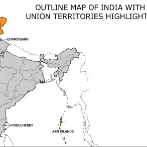 Outline map of India showing state boundaries in gray and union territories in orange, including Ladakh, Delhi, Chandigarh, and island territories.