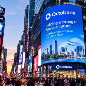 A giant blue Octobank billboard promotes a stronger financial future above bustling Times Square, where crowds and glowing signs create an energetic city scene.