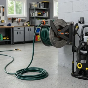all-mounted steel hose reel with a pressure washer hose partly pulled out.